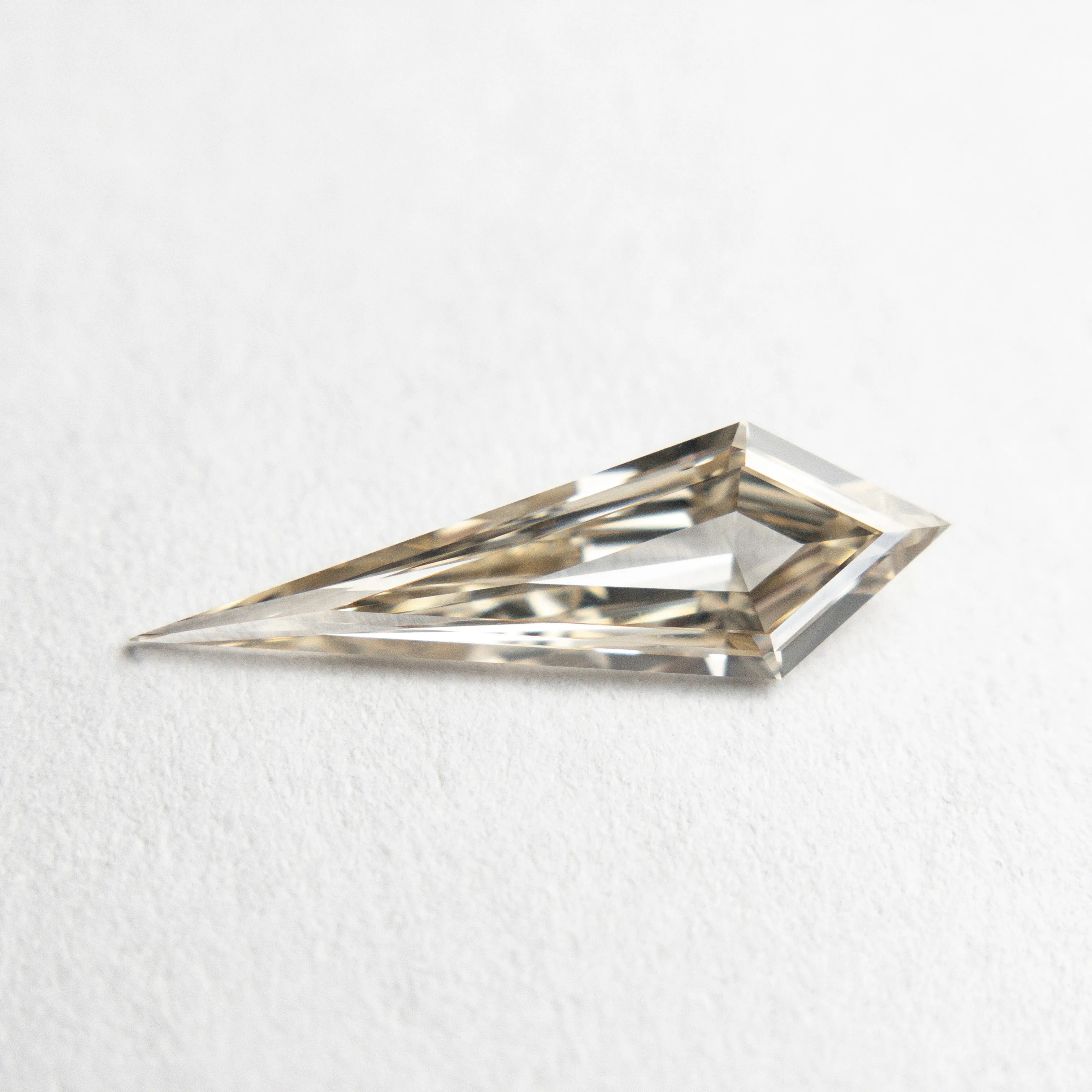 0.58ct 13.83x4.36x1.91mm VS+ Champagne Kite Step Cut 18518-01